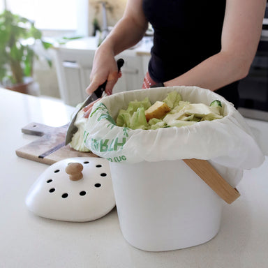 Compostable Bin Liner in compost bin with food scraps