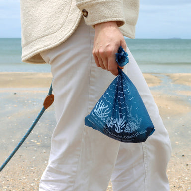 Lady holding Recycled Plastic Dog Poop Bag
