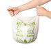 Hand holding an Ecopack 8L compostable bin liner to show size and thickness