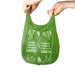 Hands holding 8L green compostable bin liners bag with tie handles