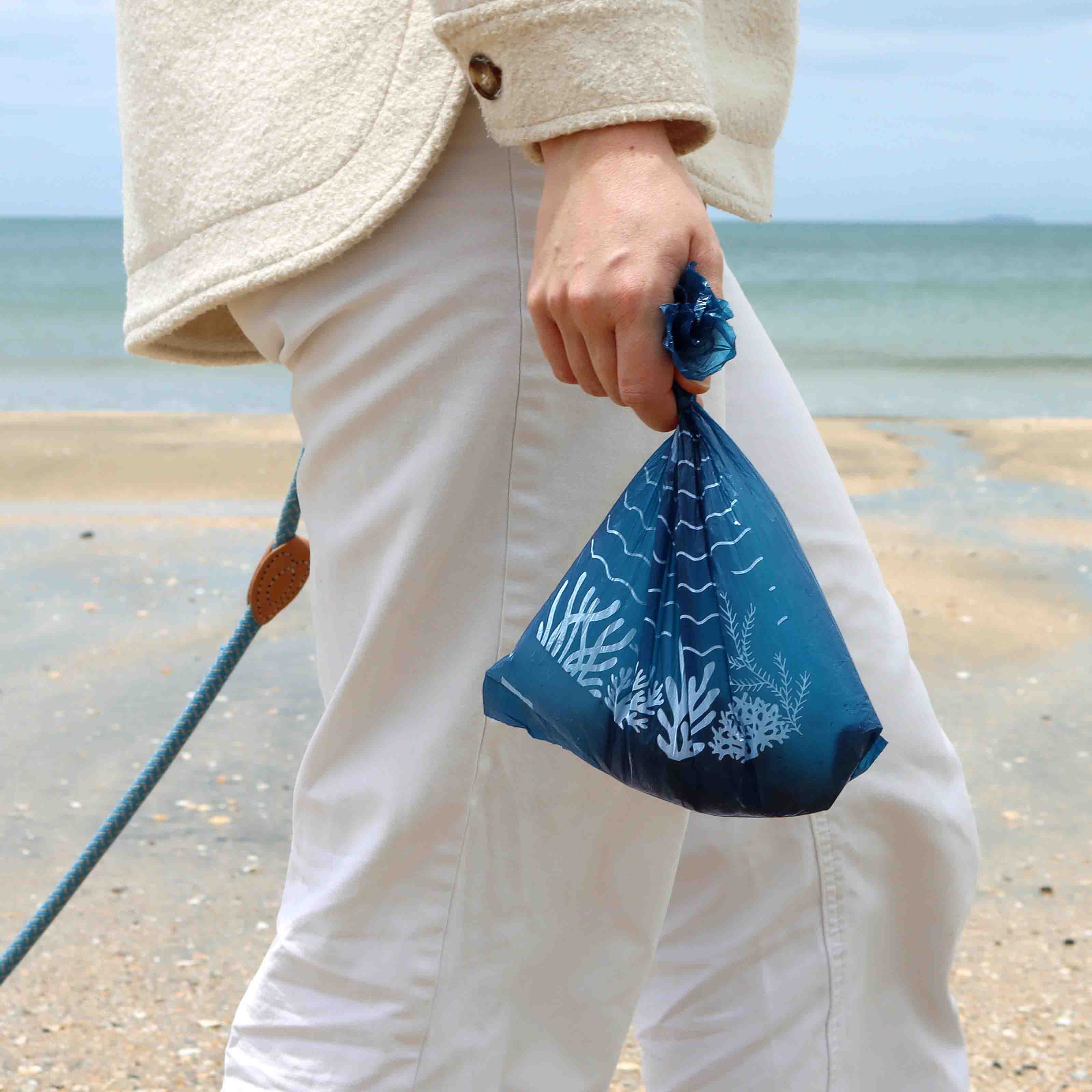 Holding the Recycled Plastic Dog Poop Bag