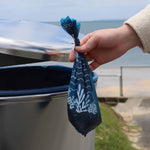 Throwing the Recycled Plastic Dog Poop Bag into the bin