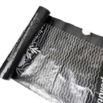 Black and white patterned paper with wavy lines on a white background