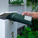 Inserting DLE Compostable Courier Bag into Mailbox