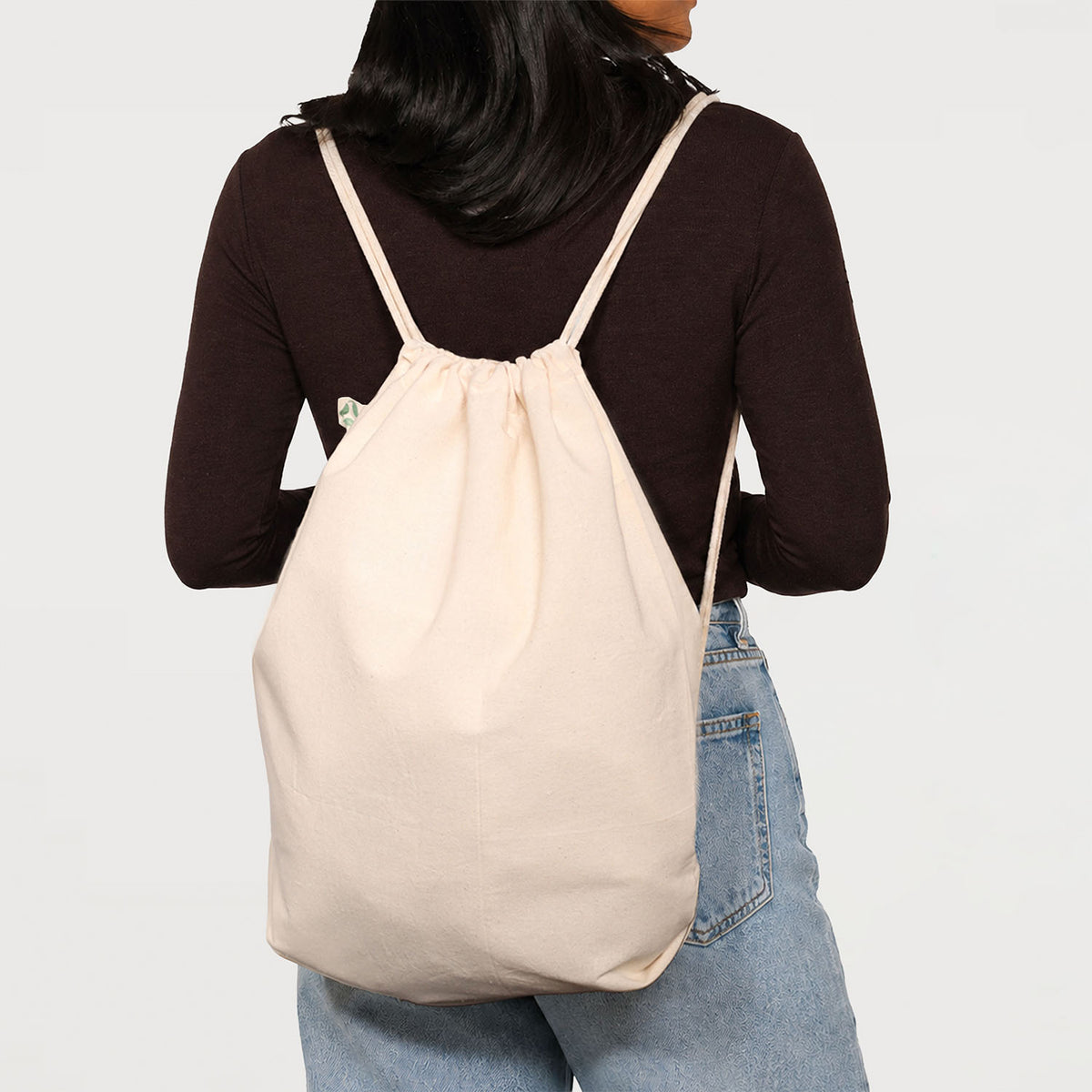 Model Wearing Natural Calico Drawstring Backpack Bags