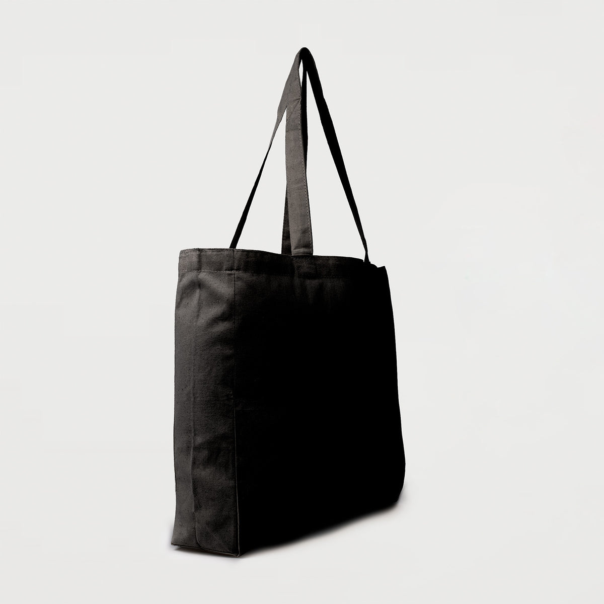 Black calico tote bag with bottom gusset and long handles side view