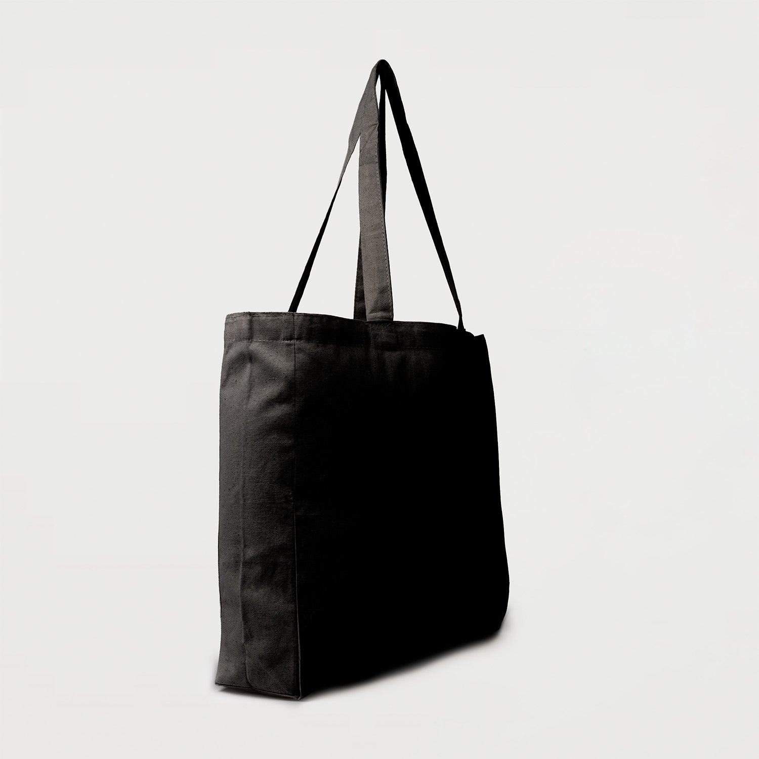 Black calico tote bag with bottom gusset and long handles side view
