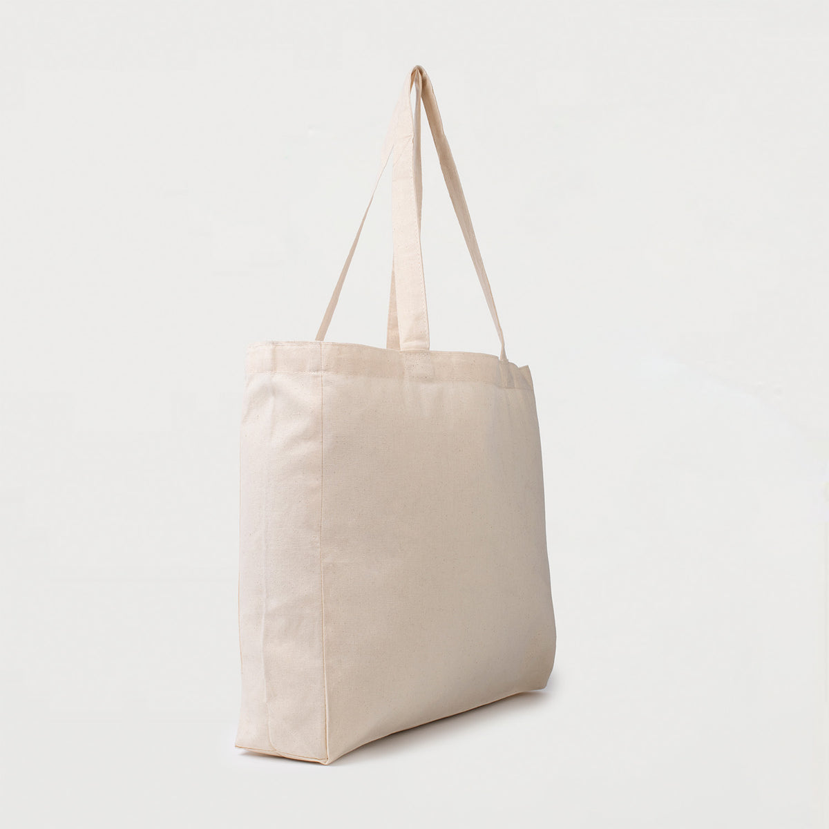 Natural calico tote bag with bottom gusset and long handles side view