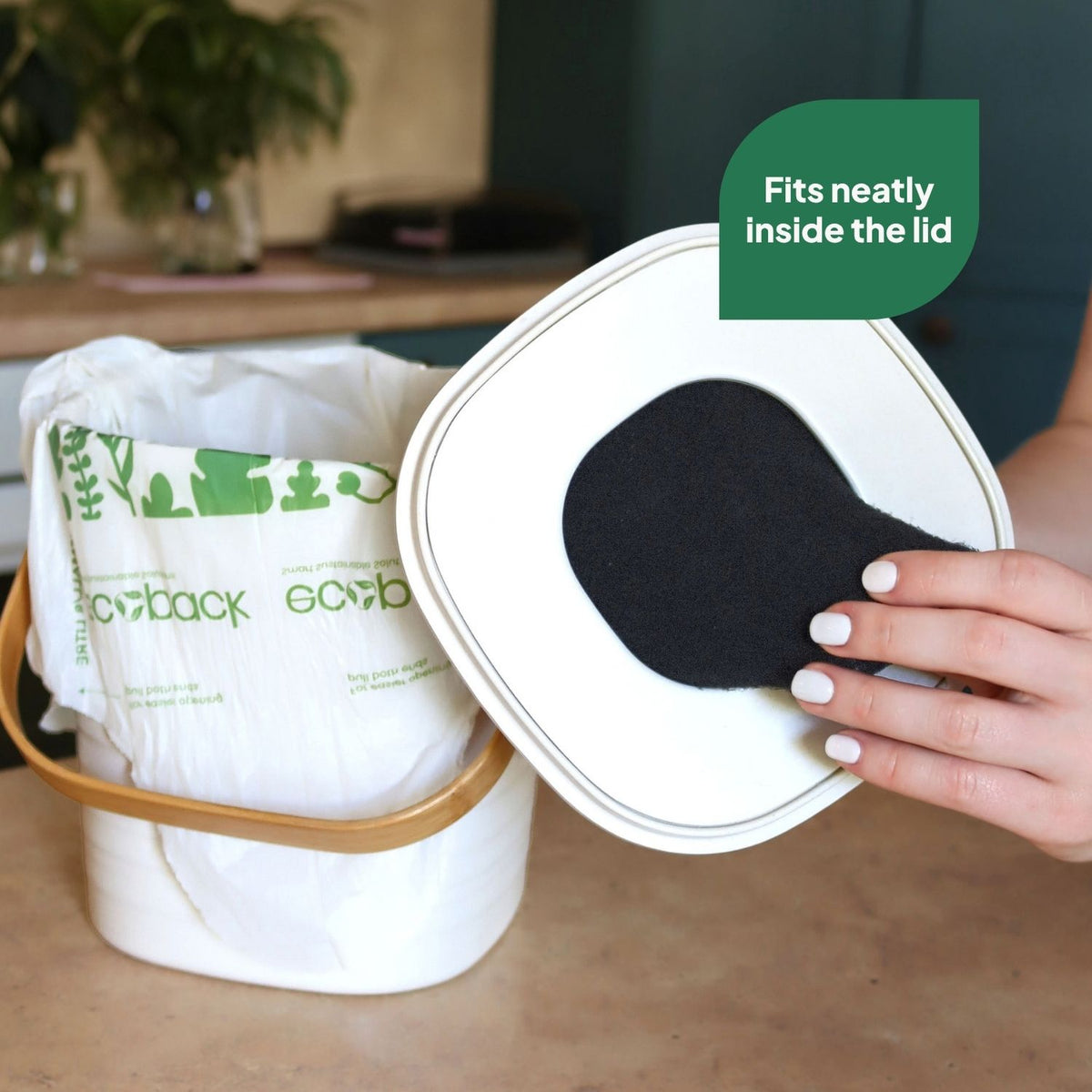 Ecopack charcoal filter fitting neatly inside the lid of a kitchen compost bin
