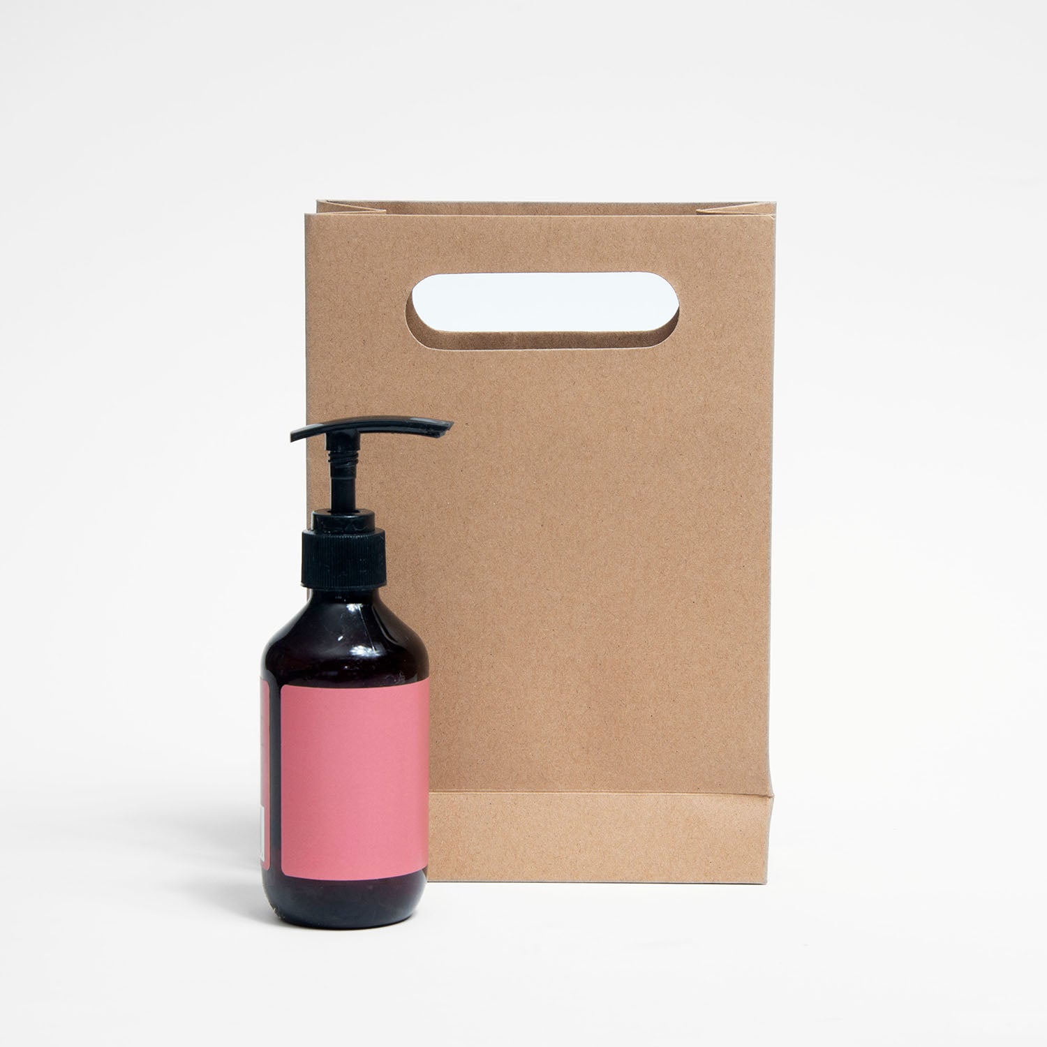 Ecopack Small Punched Out Handle Paper Bag next to a product