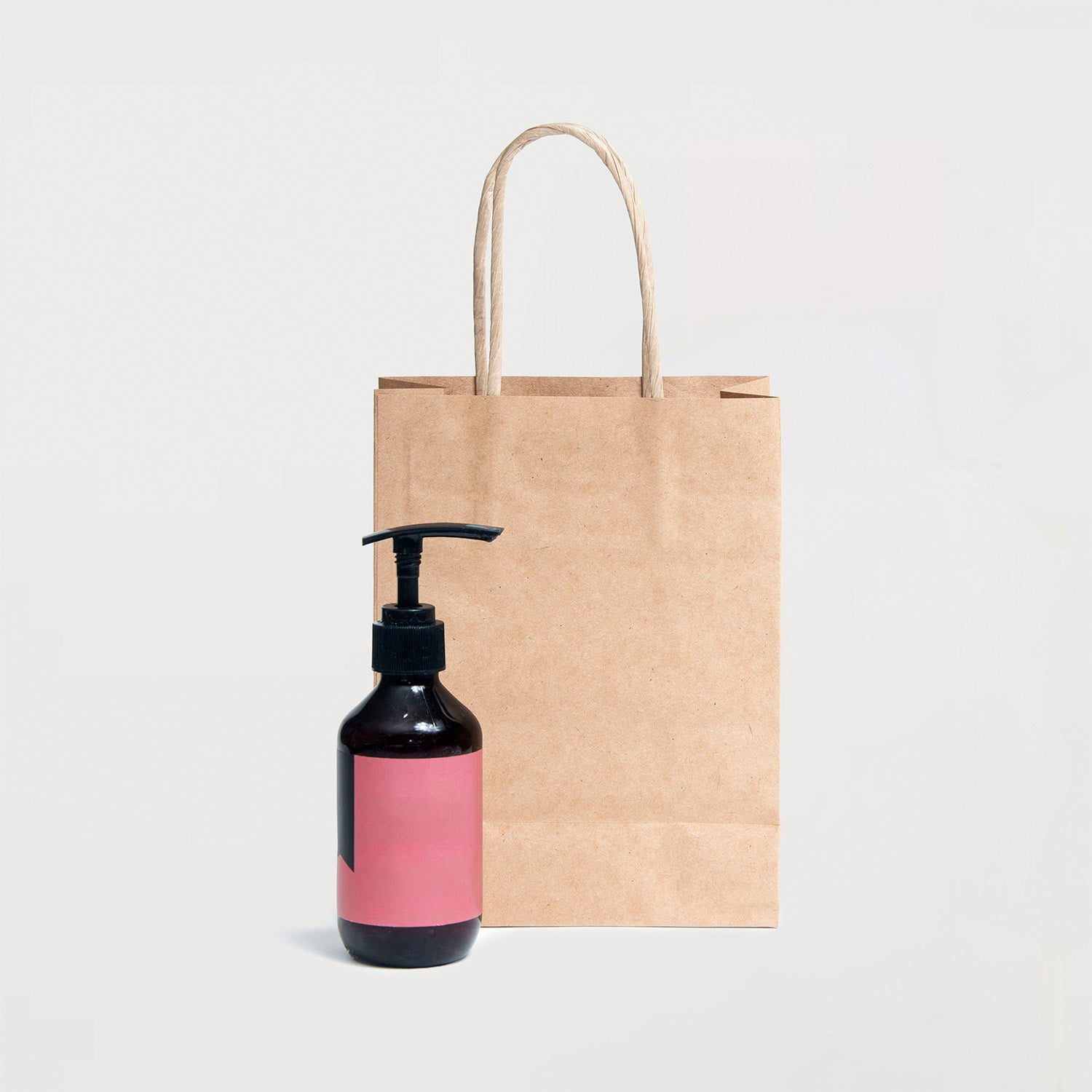 Ecopack Small/Accessory Twisted Handle Paper Bag next to a product