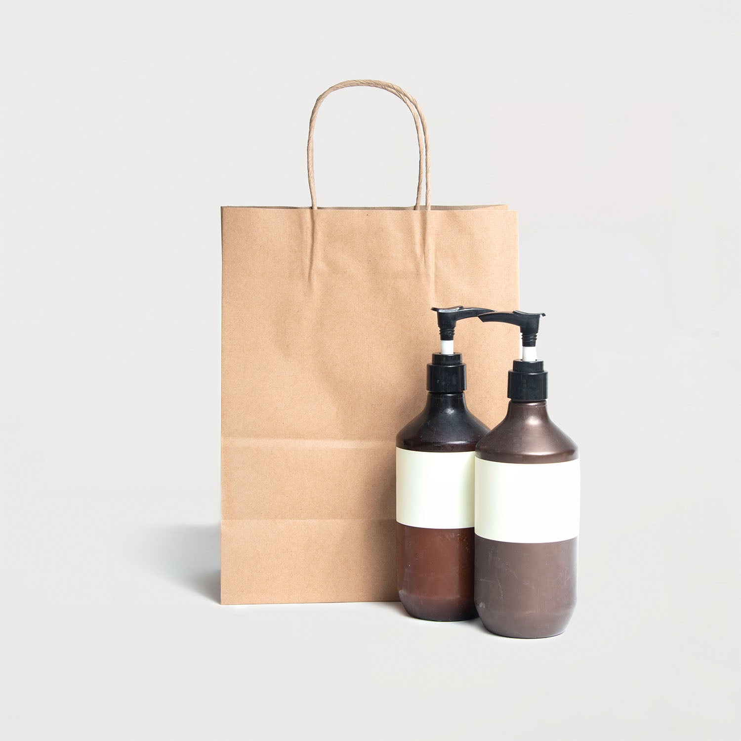 Ecopack Small Twisted Handle Paper Bag next to a product